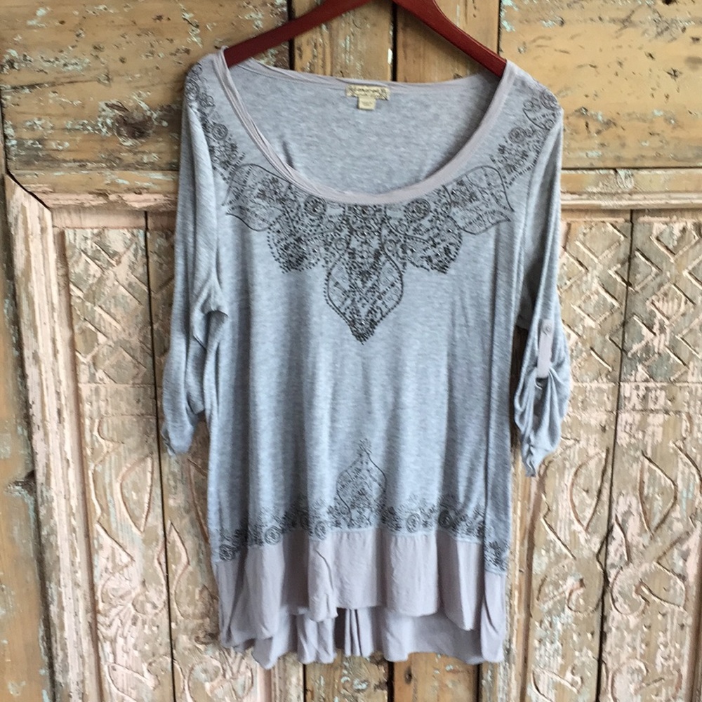 Gray top with sequin detail and ruffle bottom